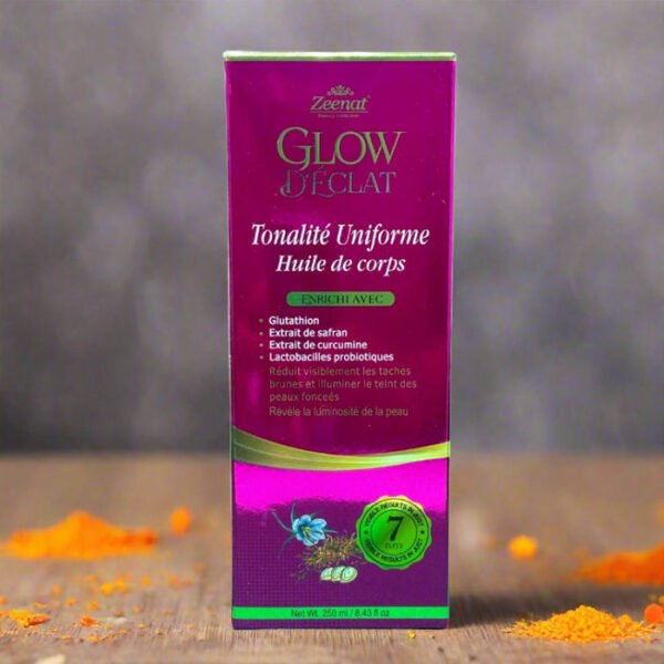 Zeenat Glow Booster Even Tone Body Oil 250ml packaging on a textured surface.